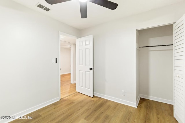 9340 Norfolk Blvd, Jacksonville, FL 32208 - unfurnished bedroom with light wood-style floors, a closet, and ceiling fan