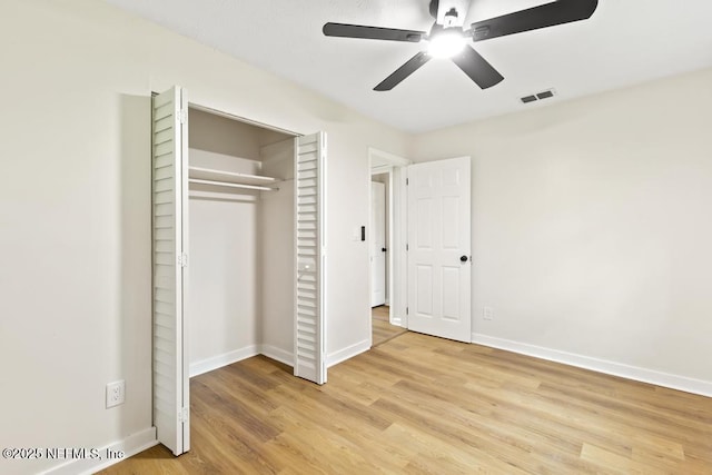 9340 Norfolk Blvd, Jacksonville, FL 32208 - unfurnished bedroom with wood finished floors, a closet, and ceiling fan