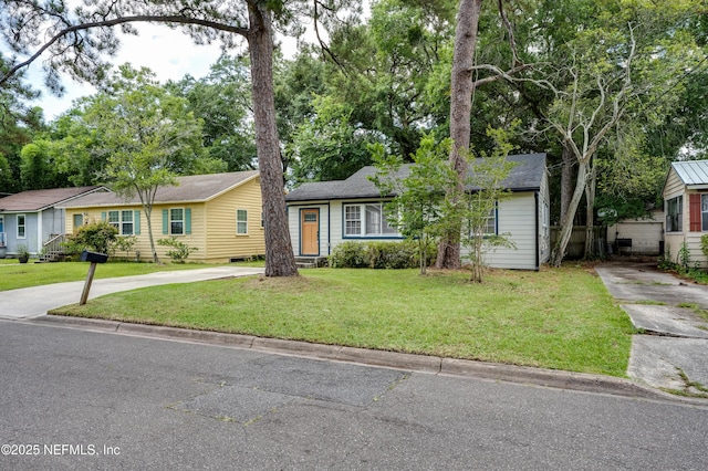 3516 Myra St, Jacksonville, FL 32205 - view of front of property with driveway and a front yard