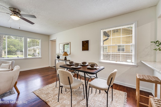 3516 Myra St, Jacksonville, FL 32205 - dining area with dark wood-style floors, ceiling fan, and a textured ceiling