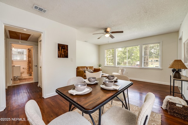 3516 Myra St, Jacksonville, FL 32205 - dining area with attic access, a ceiling fan, wood finished floors, and a textured ceiling