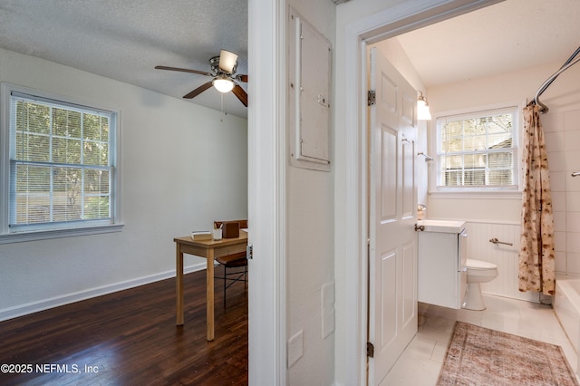 3516 Myra St, Jacksonville, FL 32205 - bathroom with ceiling fan, shower / bath combination with curtain, wood finished floors, and vanity