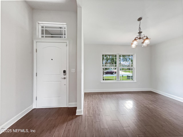 6191 Daylilly Rd, Macclenny, FL 32063 - foyer with a chandelier and dark wood finished floors
