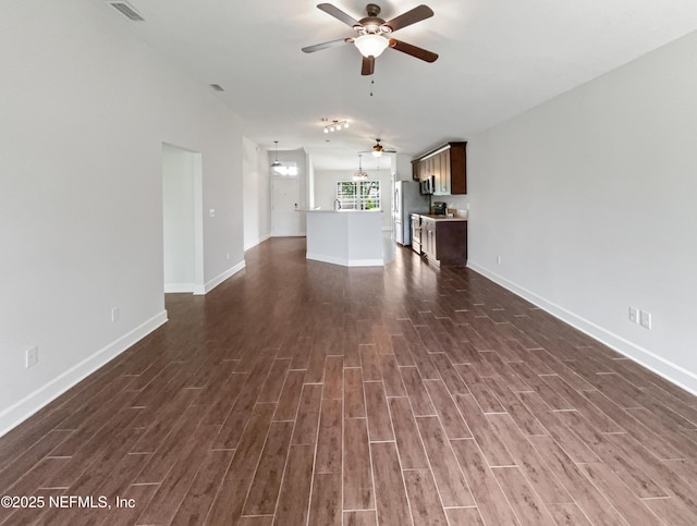 6191 Daylilly Rd, Macclenny, FL 32063 - unfurnished living room featuring a ceiling fan and dark wood-style floors