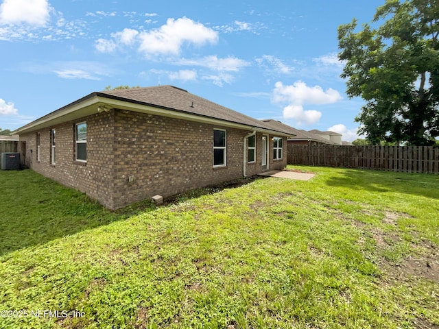 6191 Daylilly Rd, Macclenny, FL 32063 - rear view of property with brick siding and a patio