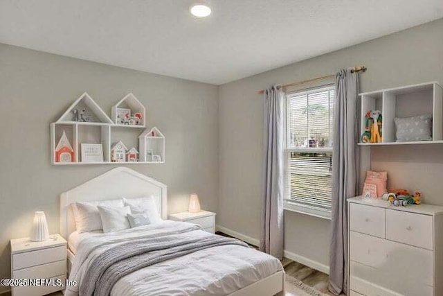 5050 San Juan Ave, Jacksonville, FL 32210 - bedroom featuring baseboards and wood finished floors