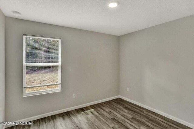 5050 San Juan Ave, Jacksonville, FL 32210 - spare room with wood finished floors and a textured ceiling