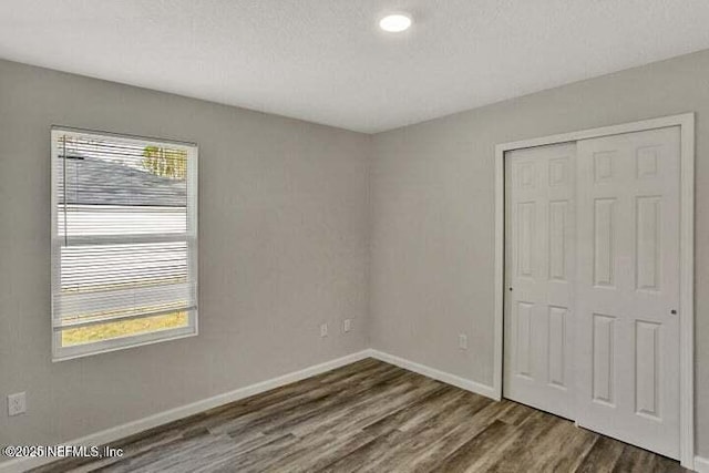 5050 San Juan Ave, Jacksonville, FL 32210 - unfurnished bedroom with dark wood finished floors, a closet, and recessed lighting