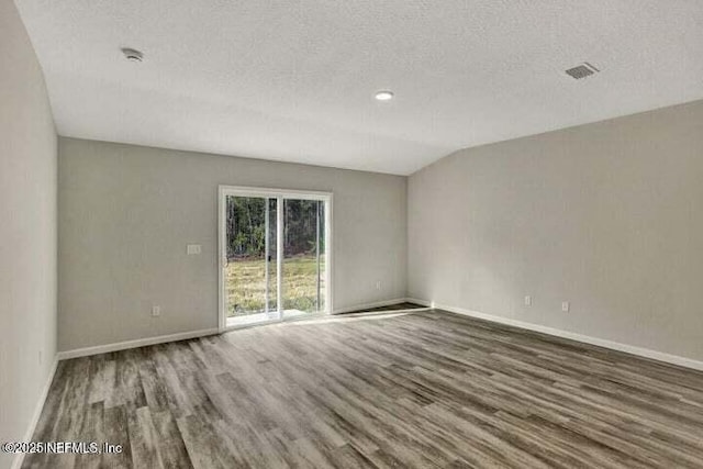 5050 San Juan Ave, Jacksonville, FL 32210 - unfurnished room featuring wood finished floors, a smoke detector, and a textured ceiling
