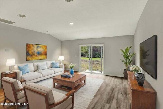 5050 San Juan Ave, Jacksonville, FL 32210 - living area featuring light wood-type flooring, lofted ceiling, and recessed lighting