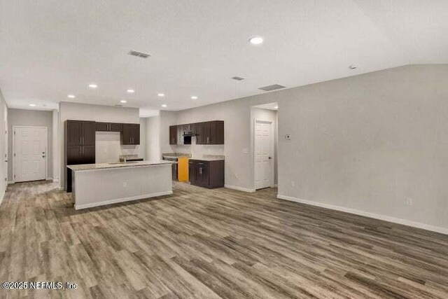 5050 San Juan Ave, Jacksonville, FL 32210 - kitchen featuring wood finished floors, recessed lighting, open floor plan, and dark brown cabinets