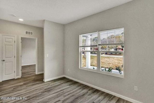 5050 San Juan Ave, Jacksonville, FL 32210 - empty room featuring healthy amount of natural light, wood finished floors, and recessed lighting