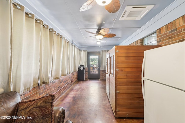 1071 Foxmeadow Trl, Middleburg, FL 32068 - corridor with brick wall and concrete flooring