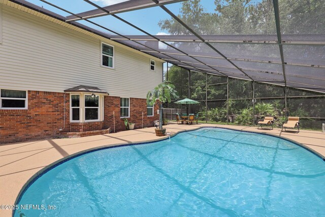 1071 Foxmeadow Trl, Middleburg, FL 32068 - view of swimming pool featuring a patio area and glass enclosure