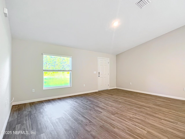 9473 N Athenia Dr, Citrus Springs, FL 34434 - empty room featuring dark wood-style flooring and baseboards