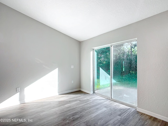 9473 N Athenia Dr, Citrus Springs, FL 34434 - empty room featuring wood finished floors and baseboards
