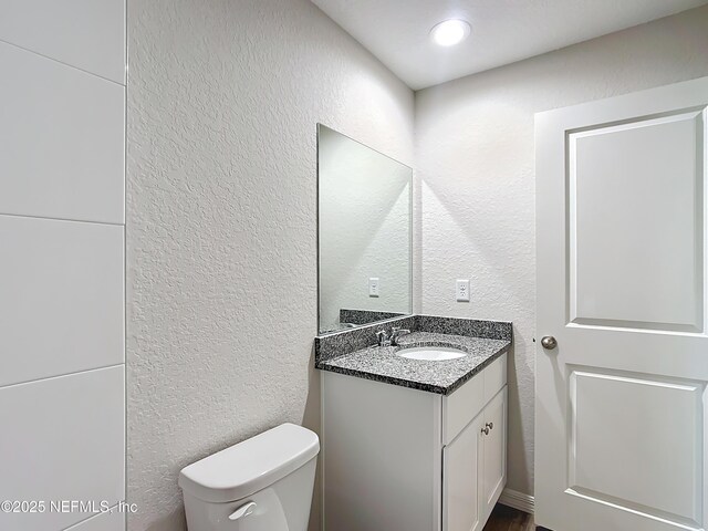 9473 N Athenia Dr, Citrus Springs, FL 34434 - bathroom with a textured wall and vanity
