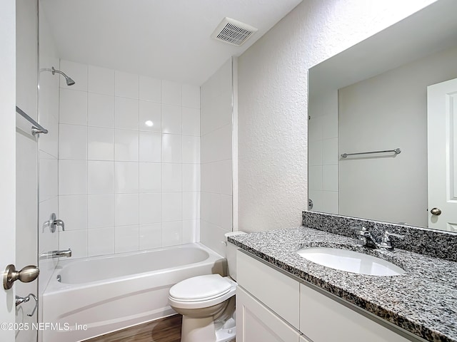 9473 N Athenia Dr, Citrus Springs, FL 34434 - full bathroom featuring a textured wall, vanity, and tub / shower combination