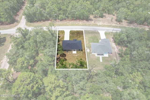 9473 N Athenia Dr, Citrus Springs, FL 34434 - view from above of property with property boundaries highlighted and a heavily wooded area