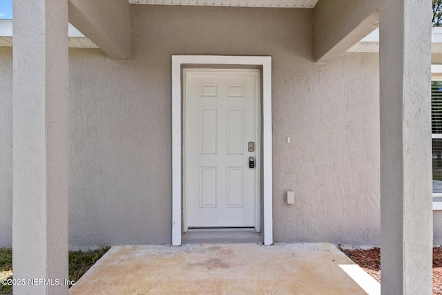 9473 N Athenia Dr, Citrus Springs, FL 34434 - property entrance featuring stucco siding