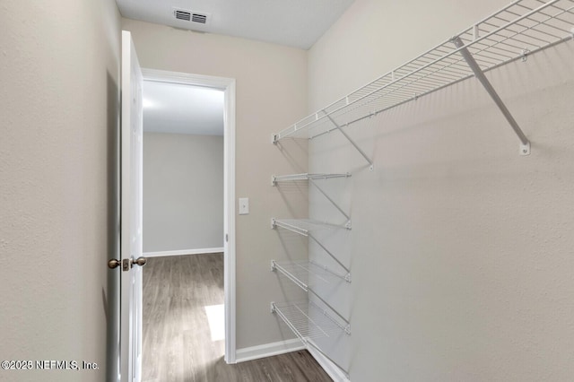 4730 Ridgewood Ave, Jacksonville, FL 32207 - spacious closet featuring wood finished floors