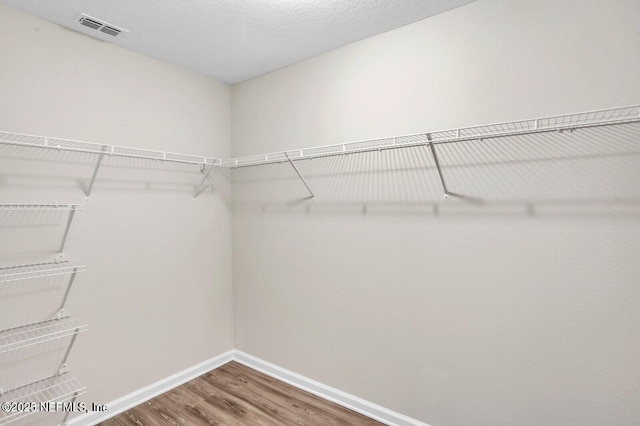 4730 Ridgewood Ave, Jacksonville, FL 32207 - spacious closet featuring wood finished floors