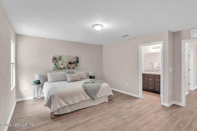 4730 Ridgewood Ave, Jacksonville, FL 32207 - bedroom with light wood-type flooring and ensuite bath
