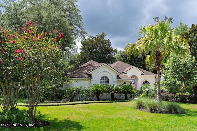 13464 Ellsworth Ln, Jacksonville, FL 32225 - view of front of home with stucco siding and a front yard