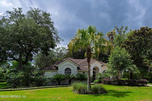 13464 Ellsworth Ln, Jacksonville, FL 32225 - mediterranean / spanish-style house with stucco siding and a front yard