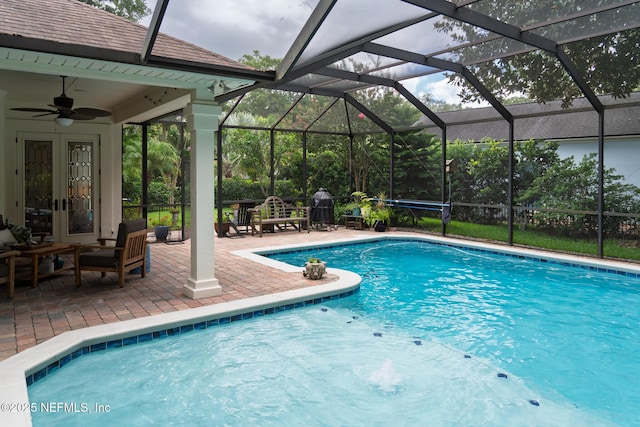 13464 Ellsworth Ln, Jacksonville, FL 32225 - outdoor pool with a patio area, ceiling fan, french doors, and glass enclosure