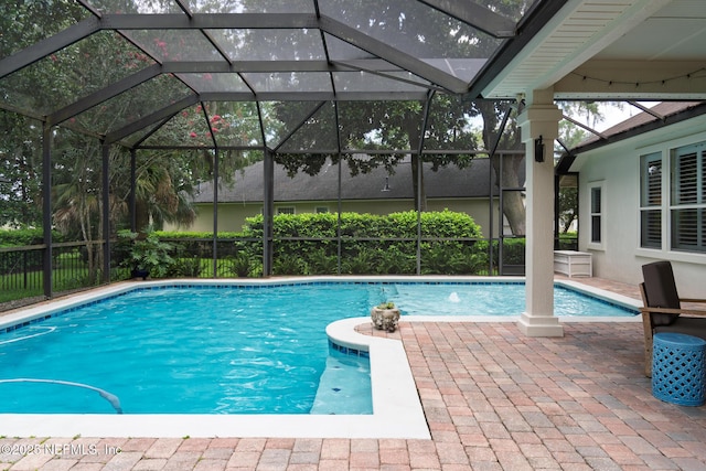 13464 Ellsworth Ln, Jacksonville, FL 32225 - view of swimming pool featuring glass enclosure and a patio