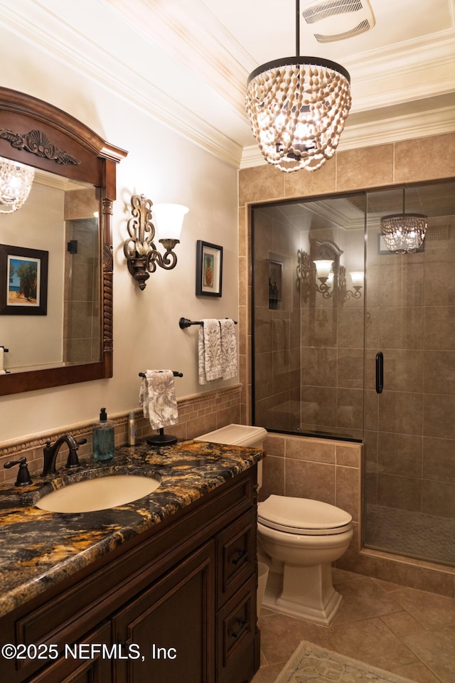 13464 Ellsworth Ln, Jacksonville, FL 32225 - bathroom featuring a chandelier, vanity, tile patterned flooring, a shower stall, and ornamental molding
