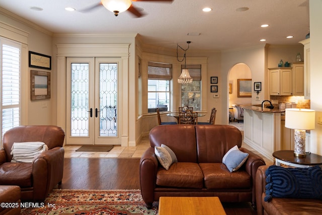 13464 Ellsworth Ln, Jacksonville, FL 32225 - living area featuring arched walkways, french doors, ceiling fan, recessed lighting, and light wood finished floors
