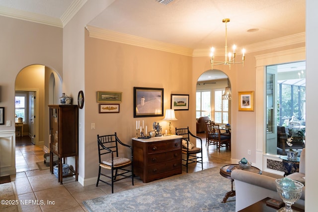 13464 Ellsworth Ln, Jacksonville, FL 32225 - tiled living room with arched walkways, healthy amount of natural light, a chandelier, and crown molding