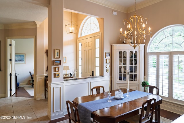 13464 Ellsworth Ln, Jacksonville, FL 32225 - dining area with a chandelier, ornamental molding, and tile patterned flooring