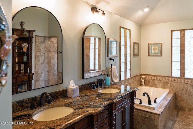 13464 Ellsworth Ln, Jacksonville, FL 32225 - bathroom with double vanity, a bath, and lofted ceiling