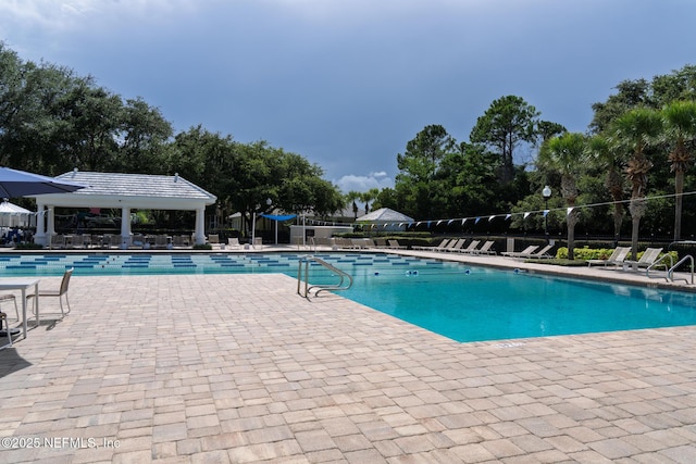 13464 Ellsworth Ln, Jacksonville, FL 32225 - community pool with a patio area and view of scattered trees