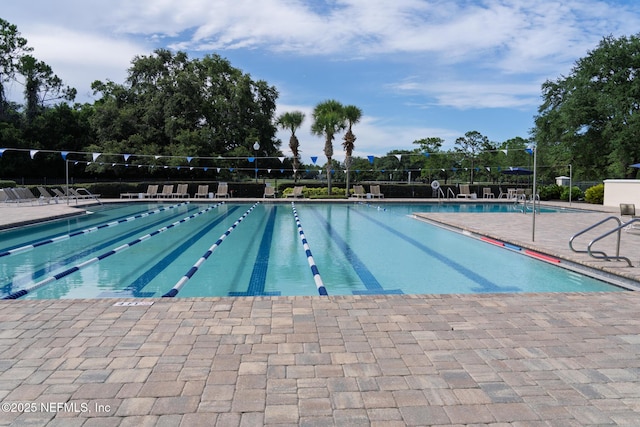 13464 Ellsworth Ln, Jacksonville, FL 32225 - community pool with a patio and view of scattered trees