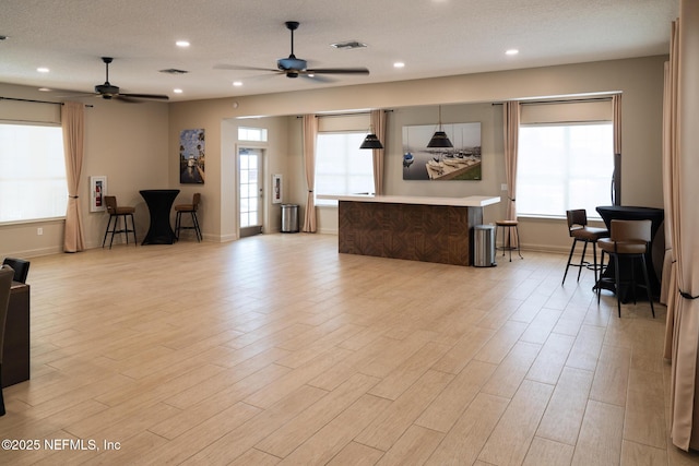 13464 Ellsworth Ln, Jacksonville, FL 32225 - living area featuring ceiling fan, light wood-type flooring, and recessed lighting