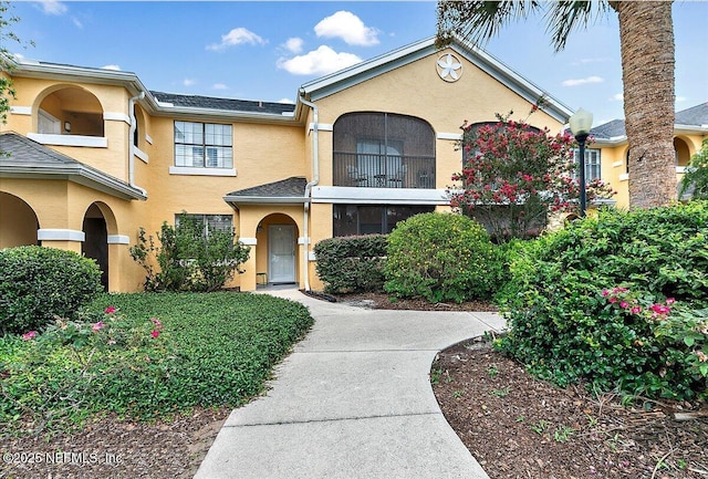 2404 Vista Cove Rd, Saint Augustine, FL 32084 - view of front of home with stucco siding and a balcony