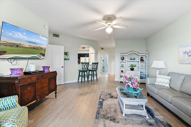 2404 Vista Cove Rd, Saint Augustine, FL 32084 - living room with ceiling fan, wood finished floors, and arched walkways