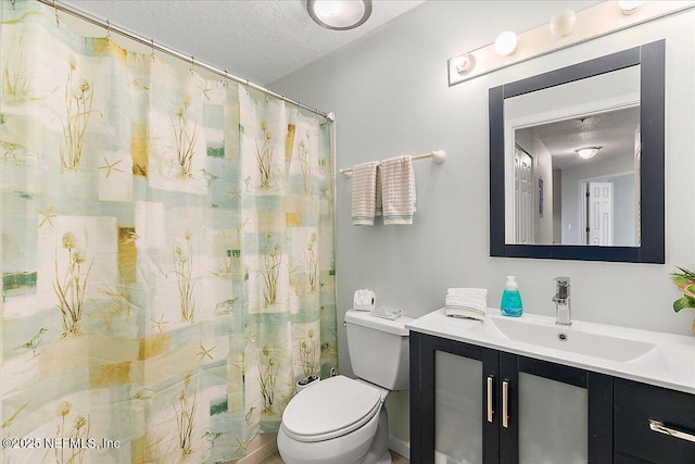 2404 Vista Cove Rd, Saint Augustine, FL 32084 - bathroom featuring a textured ceiling, vanity, and a shower with curtain