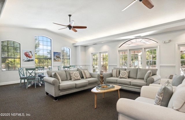 2404 Vista Cove Rd, Saint Augustine, FL 32084 - living area featuring a ceiling fan, lofted ceiling, plenty of natural light, and wainscoting
