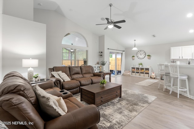 2250 Trailwood Dr, Fleming Island, FL 32003 - living area with light wood finished floors, a ceiling fan, high vaulted ceiling, and recessed lighting