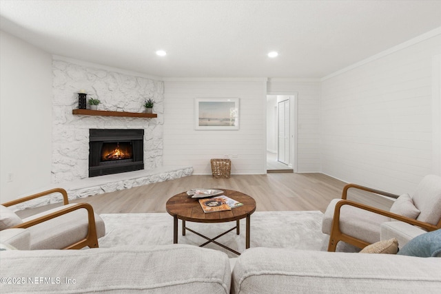 2453 Jetty Ct, Jacksonville, FL 32233 - living room featuring wood finished floors, a high end fireplace, recessed lighting, and ornamental molding