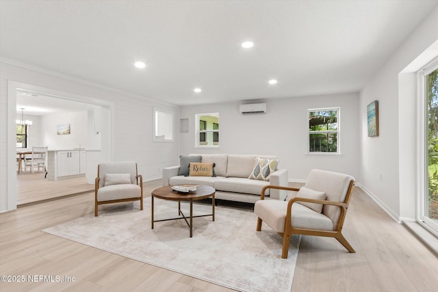 2453 Jetty Ct, Jacksonville, FL 32233 - living room with light wood-style flooring, recessed lighting, plenty of natural light, a wall unit AC, and a chandelier