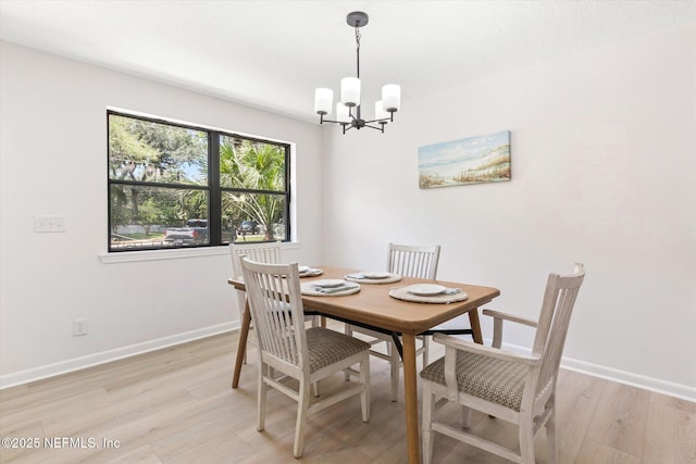 2453 Jetty Ct, Jacksonville, FL 32233 - dining space featuring a chandelier and light wood finished floors