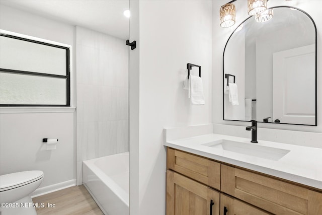 2453 Jetty Ct, Jacksonville, FL 32233 - bathroom with vanity, wood finished floors, and shower / washtub combination