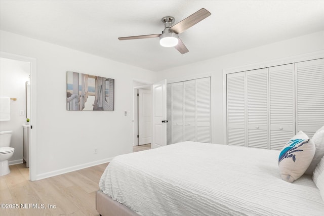 2453 Jetty Ct, Jacksonville, FL 32233 - bedroom featuring light wood-style floors, multiple closets, ensuite bath, and a ceiling fan