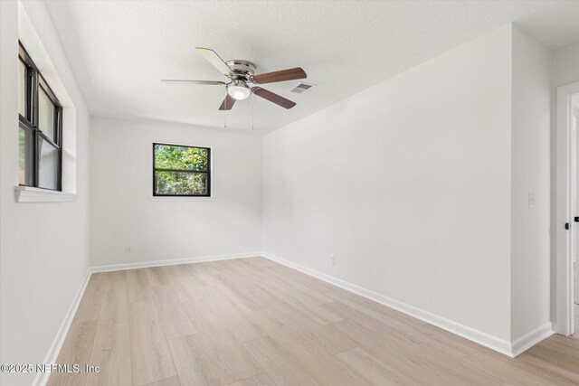 2453 Jetty Ct, Jacksonville, FL 32233 - spare room with light wood-style floors and a ceiling fan